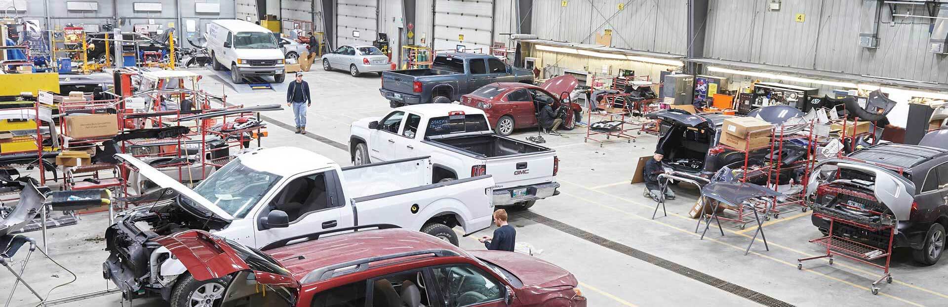 Eastside Group team working on vehicles in a garage